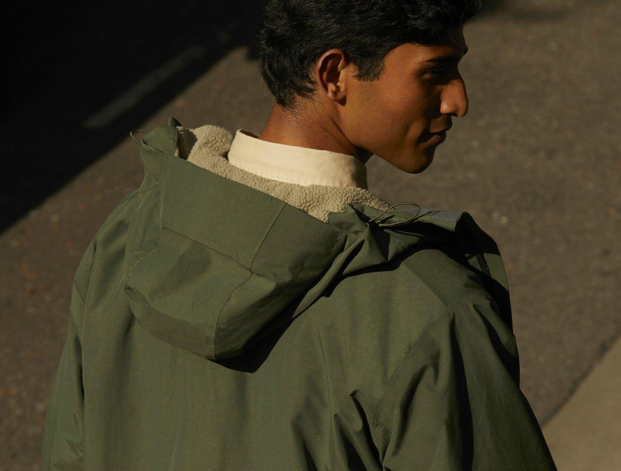 Model in green khaki parka