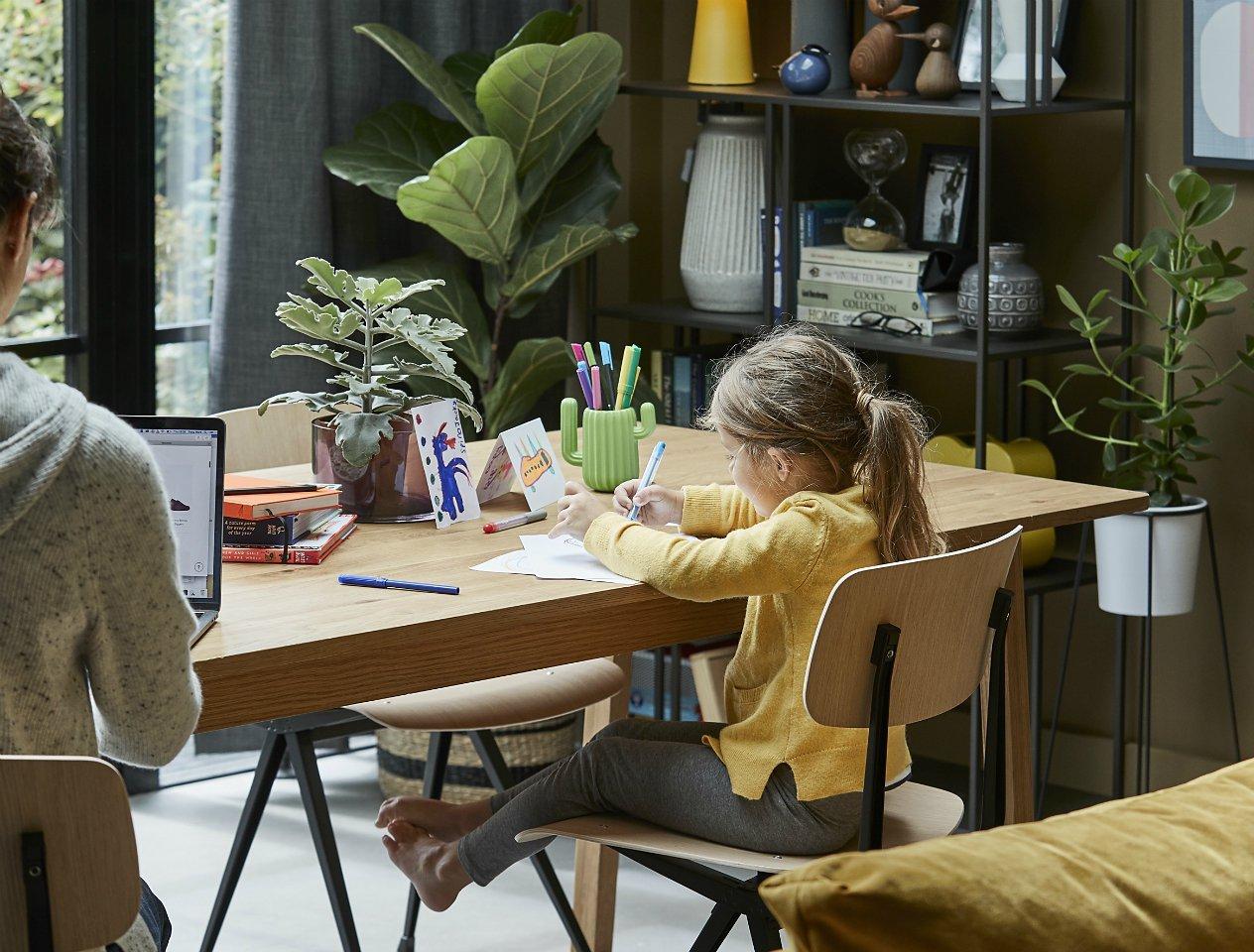 Boy at kitchen table doing craft activities