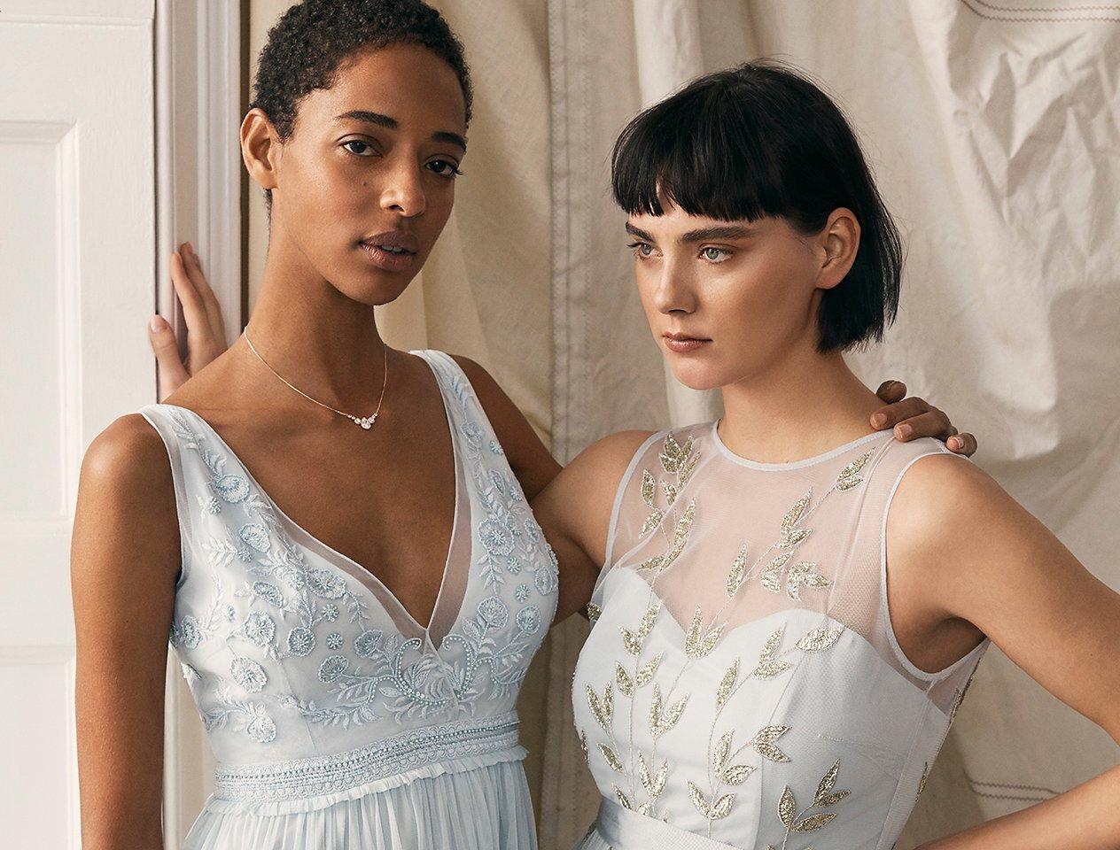 Two models in bridesmaid dresses