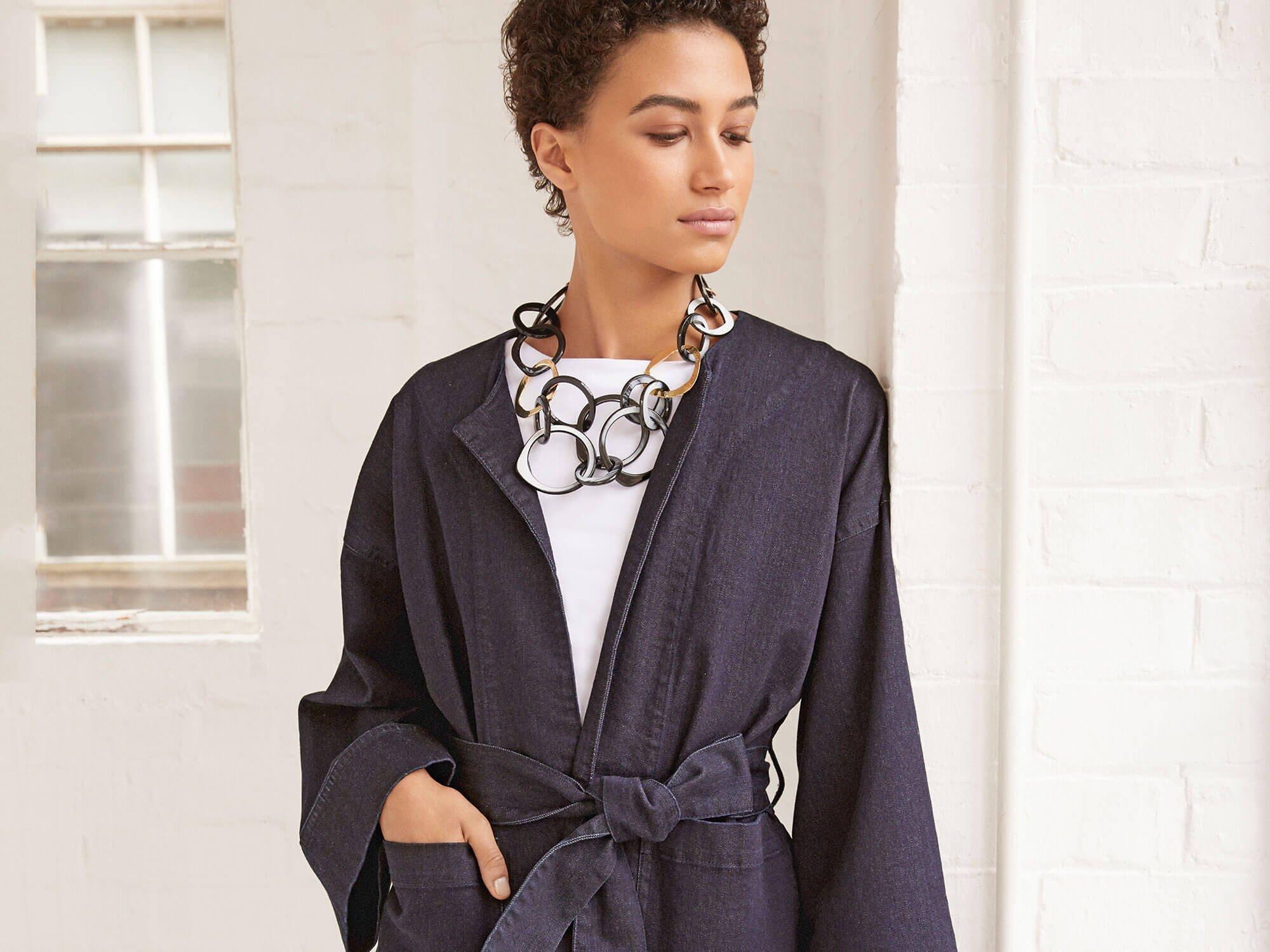 Woman in denim wrap jacket