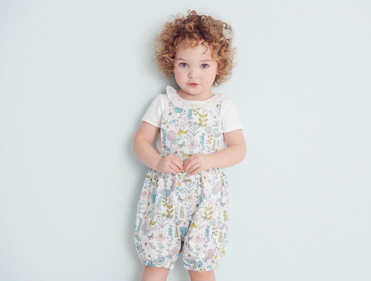 Toddler in romper suit