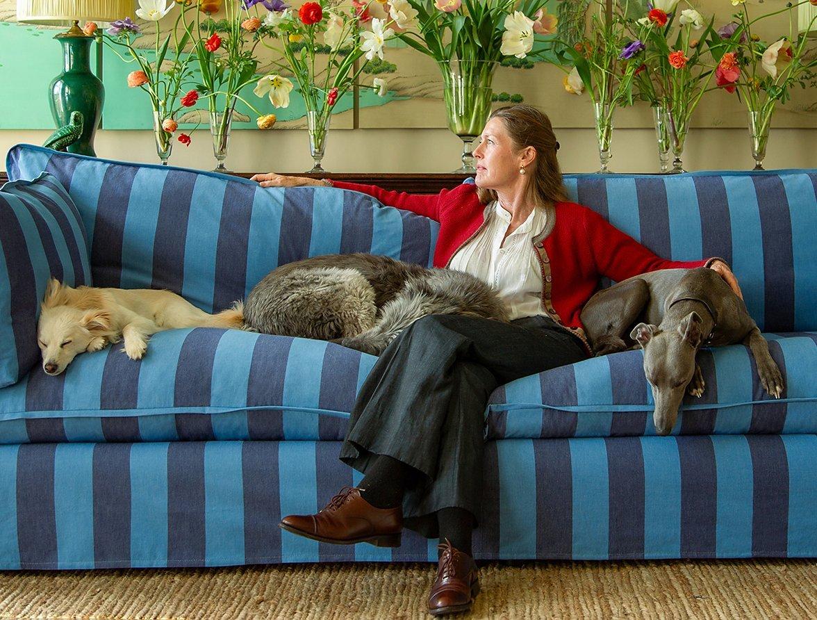 Sophie Conran sitting on sofa with dogs