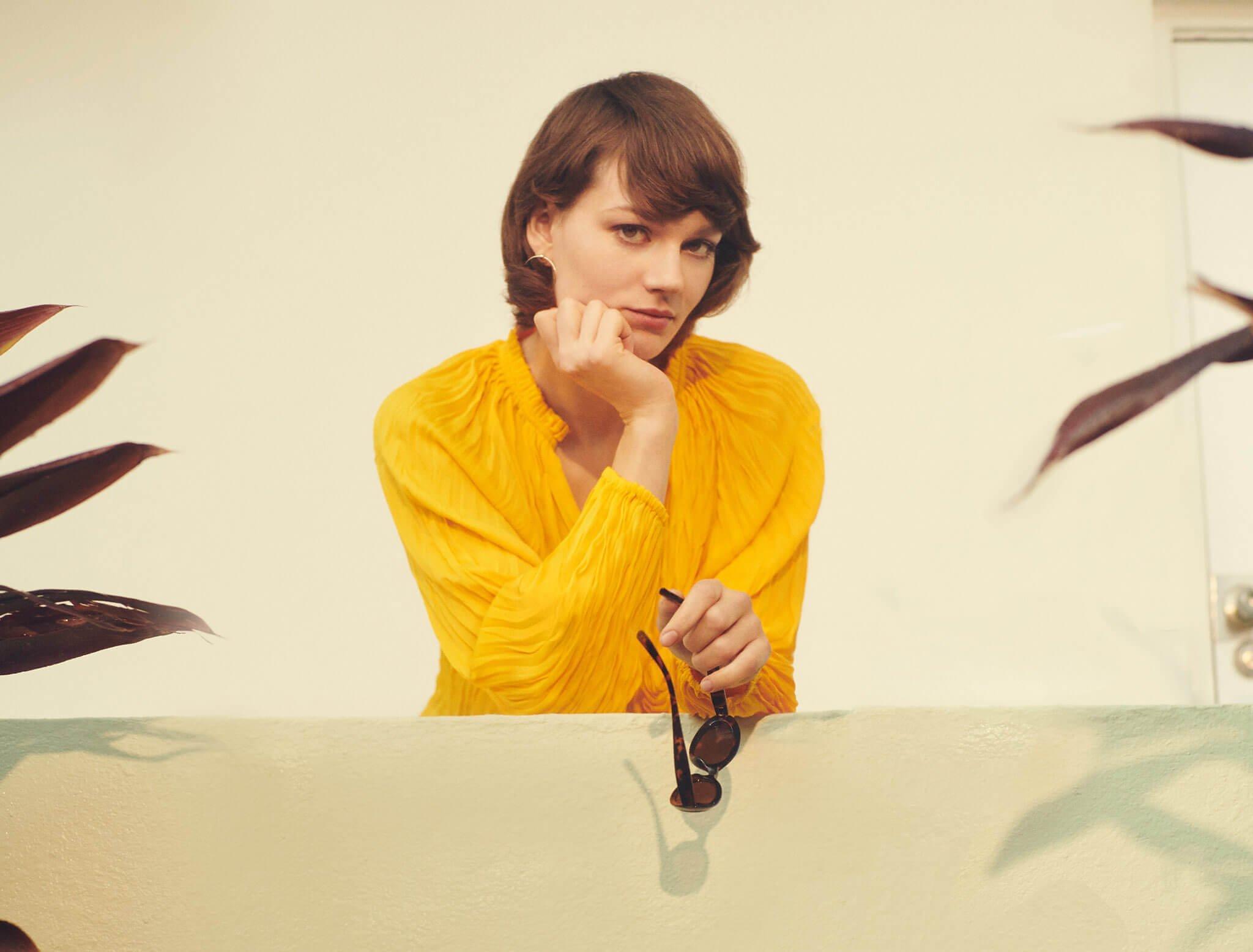 Model in yellow shirt